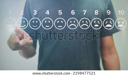 man touching smile icons of pain scale virtual screen interface, medical technology and futuristic concept.