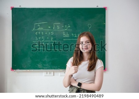 Kid write on chalk board. Back to school. Schoolchild in class. Happy kid writing green blackboard.	