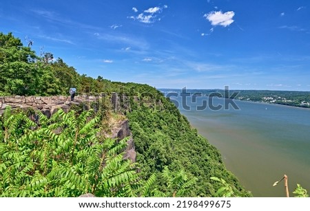 New Jersey,New York state line lookout over the Palisade cliffs and the Hudson river in the summer. With a viewfinder telescope to see New York. Located in Alpine,NJ,USA. Royalty-Free Stock Photo #2198499675
