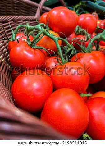 Ripe red vine tomatoes on the shelf in the grocery store Royalty-Free Stock Photo #2198511015