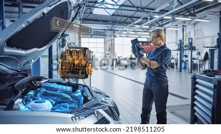 Female Mechanic Uses a Tablet Computer with an Augmented Reality Diagnostics Software. Specialist Inspecting Car's V6 Engine to Quickly Spot Broken Components. Premium Quality Car Service.