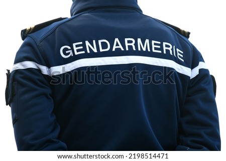 Illustration picture shows a policeman, police officer or gendarme from "gendarmerie" from the back with uniform ensuring security.
