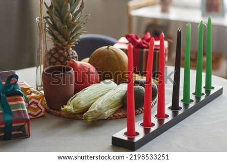 Close-up of seven candles with exotic fruits on table preparing for Kwanzaa holiday