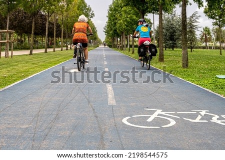 Bike path in the park. A symbol of cycle and attention paths on the pavement