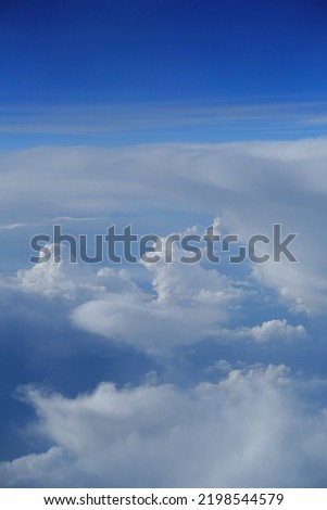 View of white clouds and blue sky at a high altitude 