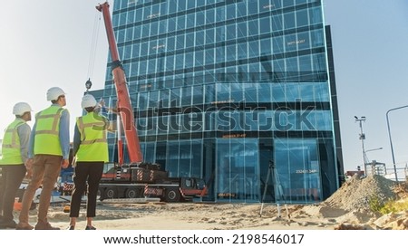 Real Estate Project Construction Site with Architectural Engineer, Investor and Worker Completing Industrial Building Development by Using 3D VFX Graphics. Futuristic Concept of Buildings Development Royalty-Free Stock Photo #2198546017