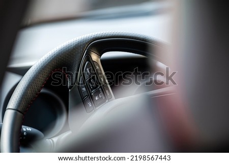 Interior view car with modern steering wheel, dashboard. Selective focus. Shallow depth of field