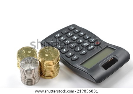 A calculator and money isolated on a white background 