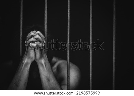 prison man crime in gaol, hold hand iron bar jail, punishment convict in justice law, cage for lock freedom, concept for stress, violence Royalty-Free Stock Photo #2198575999