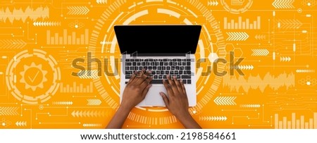Young black man typing on laptop keyboard with blank screen on orange background with abstract symbols, collage, panorama. Networking, internet service, technology, modern tech, work and education