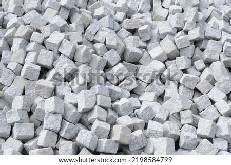 Granite paving stones in typical cube shape Royalty-Free Stock Photo #2198584799