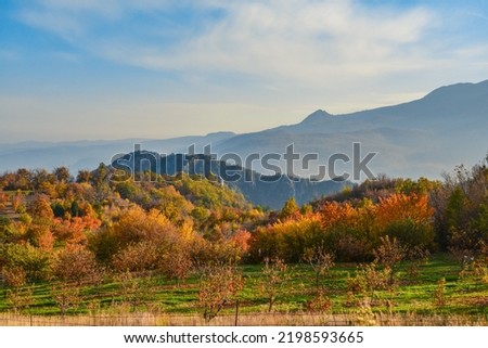 Autumn landscape in Greece  mountains with yellow, orange and red trees