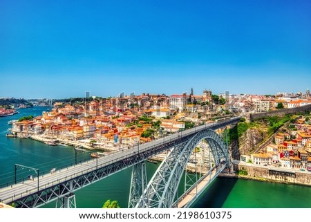 Porto Aerial Cityscape with Luis I Bridge and Douro River during a Sunny Day, Portugal  Royalty-Free Stock Photo #2198610375