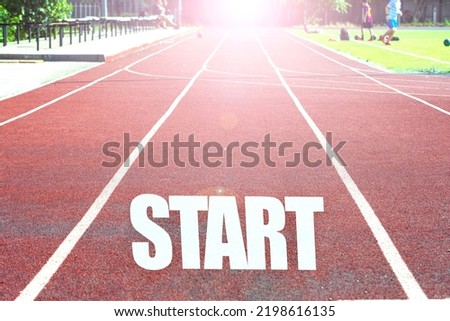 Running track in the stadium with the inscription "start 2023" The concept of the beginning of the new year