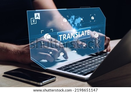 The concept of software for translation between different languages. The person works at the computer