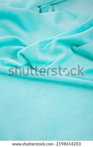 Solid color plush fabric of delicate color on a light background
