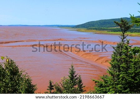 Coastline on the Bay of Fundy in New Brunswick in Canada at low tide Royalty-Free Stock Photo #2198663667