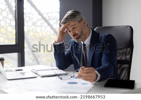 Entrepreneurship Crisis. Depressed Middle Aged Businessman Sitting At Workplace In Office, Pensive Upset Mature Entrepreneur In Suit Suffering Business Problems, Thinking About Solution, Free Space Royalty-Free Stock Photo #2198667953