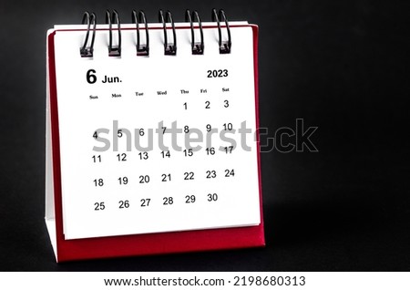 June 2023 Monthly desk calendar for 2023 year on black background.