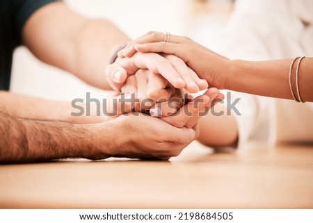 Support, care and family holding hands together at table to show empathy, love and hope. Closeup of connection, trust and friendship in community rehab group showing compassion and gratitude. Royalty-Free Stock Photo #2198684505