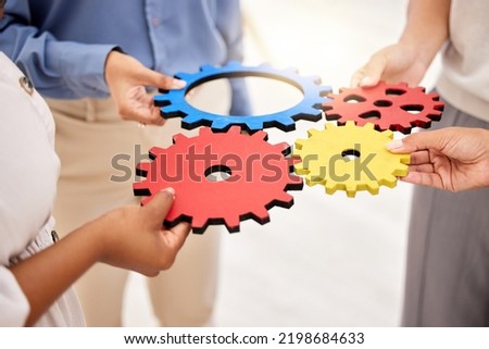 Business, collaboration and gears for strategy success and team unity and support for a project. Hands of a group of corporate employees with a common goal in a partnership for innovation Royalty-Free Stock Photo #2198684633