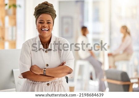 Business woman, manager and boss happy working at a startup marketing company, leadership of office employees and smile at agency. Portrait of African worker with arms crossed in work office Royalty-Free Stock Photo #2198684639