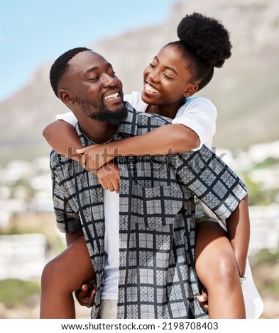 Love, happy and relax couple on beach date while on travel vacation, holiday or romantic summer honeymoon getaway. Support, romance and partnership for married black man carrying woman on Brazil trip Royalty-Free Stock Photo #2198708403
