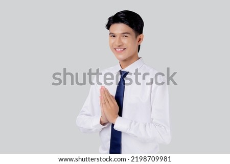Happy young asian businessman to pay respect with hands isolated on white background, symbol of Thailand, happiness man with confidence, one person, business concept. Royalty-Free Stock Photo #2198709981