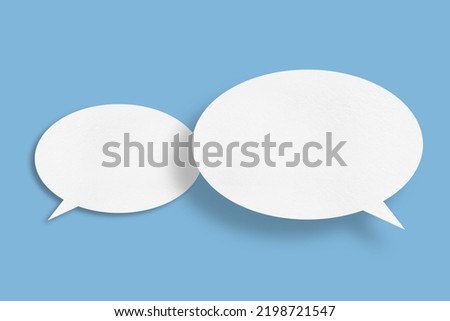 white paper with speech bubbles isolated on blue background communication bubbles design.