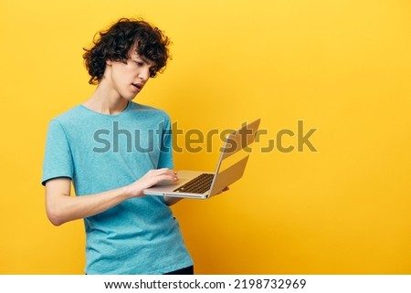 student in blue t-shirts with laptop internet Lifestyle technology