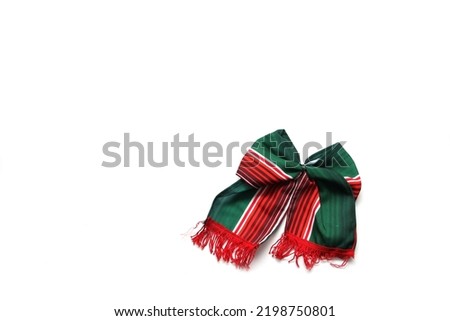 Decorative objects of Mexican party: pennants, green, white and red tricolor tie to celebrate Independence Day, Revolution and Day of the Dead in Mexico Royalty-Free Stock Photo #2198750801