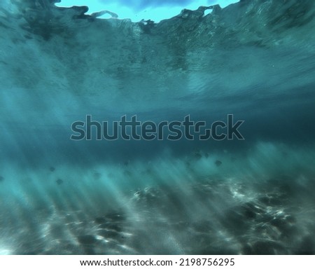 Magical underwater colours, as waves rolls by onto the sandy tropical beaches.