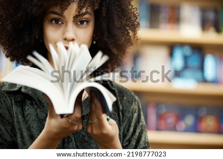 Scholarship, books and girl student in library learning, studying and reading educational knowledge or information. Young, smart and afro black woman on university or college campus with school novel Royalty-Free Stock Photo #2198777023