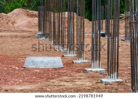 Steel columns ready to be cemented in the construction of large buildings.