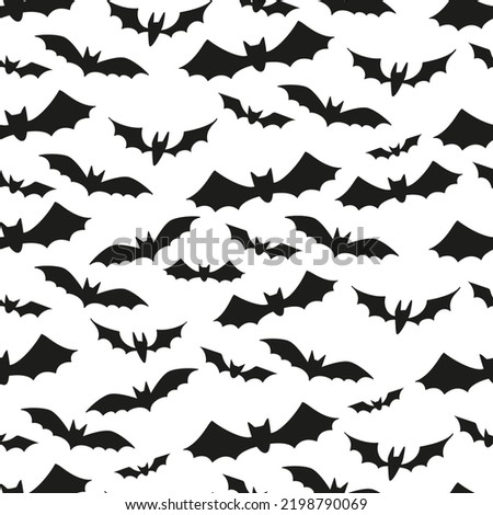 Seamless pattern with a black bats silhouettes for Halloween. Vector illustration on white background