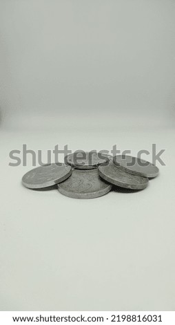 Coins stacked on a white background