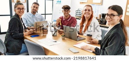 Group of business workers smiling happy working at the office