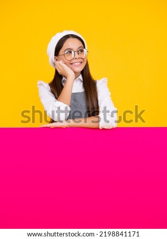 Teenage girl holds a blank for notification informing. Advertisement and sale. Markets and shops sales concept, blank board for copy space. Happy face, positive and smiling emotions of teenager girl.