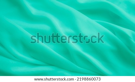Green Color Cloth Pattern Background,Silk Wave Texture Design Backdrop. Card Poster or Banner,Light Gradient Fabric Smooth Shape Colorful,Abstract Luxury green Template Wallpaper,free space top view. 