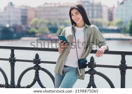 Photo of cute pretty girlfriend wear green outfit buying clothes modern gadget enjoying sunny weather outdoors city street