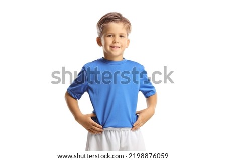 Boy in a sports jersey posing and smiling isolated on white background