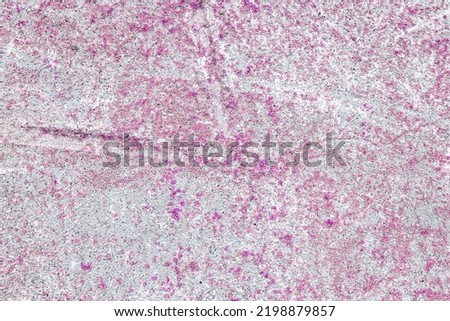 
Rough texture of pink stone. Stone facade detail of a house. Hard and rough material