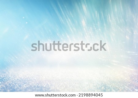 background of abstract bluer and silver glitter lights. defocused