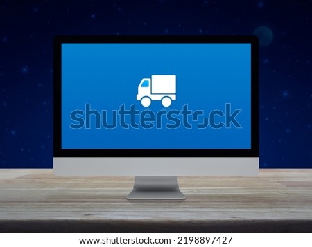 Delivery truck flat icon on desktop modern computer monitor screen on wooden table over fantasy night sky and moon, Business transportation online concept