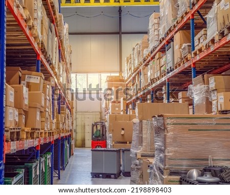 Background cardboard boxes inside warehouse. Logistics center. Composition filled with cardboard boxes. Royalty-Free Stock Photo #2198898403