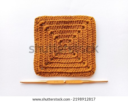 Crochet granny square pattern. Crochet instrument and knitted patterns. Royalty-Free Stock Photo #2198912817