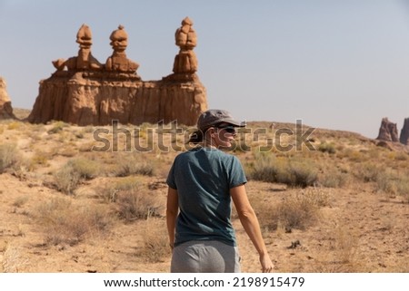 Young woman in sunglasses at Goblin Valley State Park in Utah Royalty-Free Stock Photo #2198915479