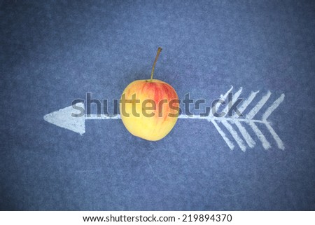 Apple and doodle arrow on chalkboard. Concept about success.