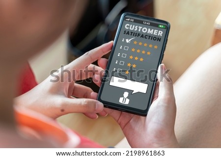 Customer experience and online review concept. female sitting in house to reading customer review in smartphone before buying products. top view