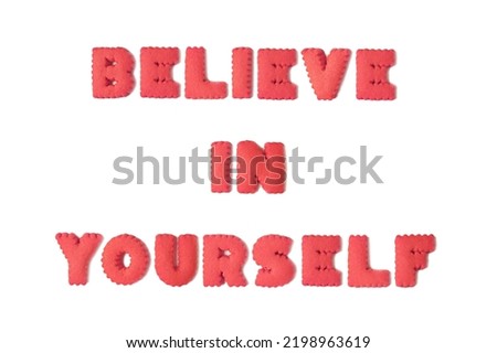 Text of encouragement spelled with imperial red alphabet shaped cookies on white background